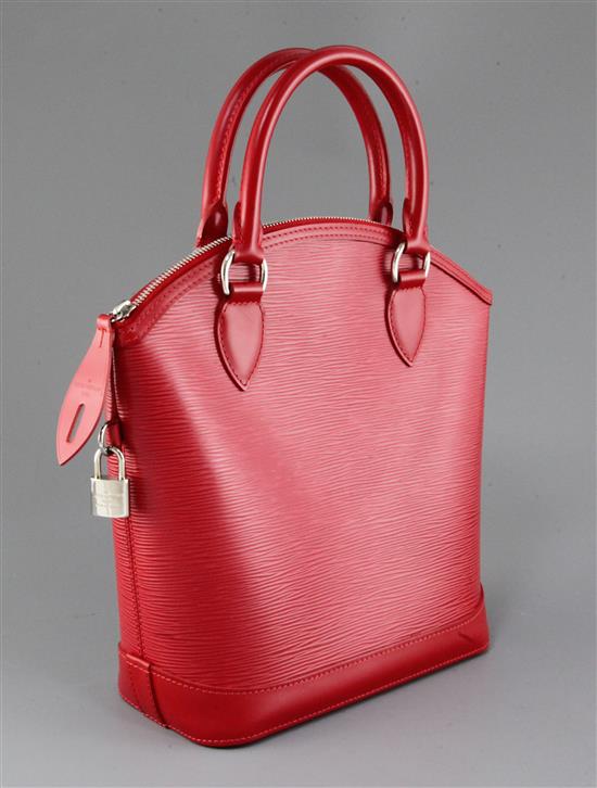 A Louis Vuitton red leather handbag, 12in.